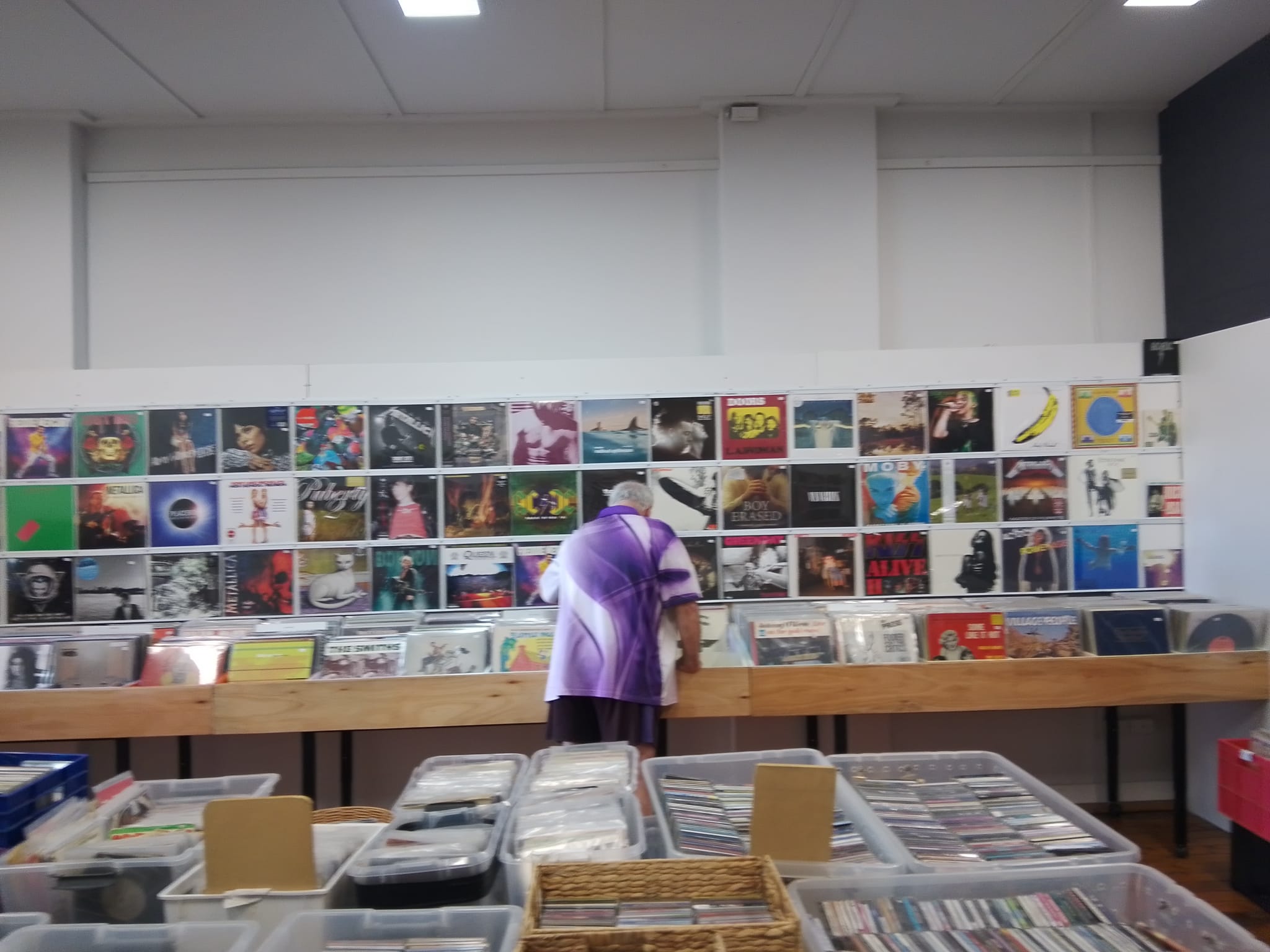 RockMasta Records shop wall with vinyl records and record bins