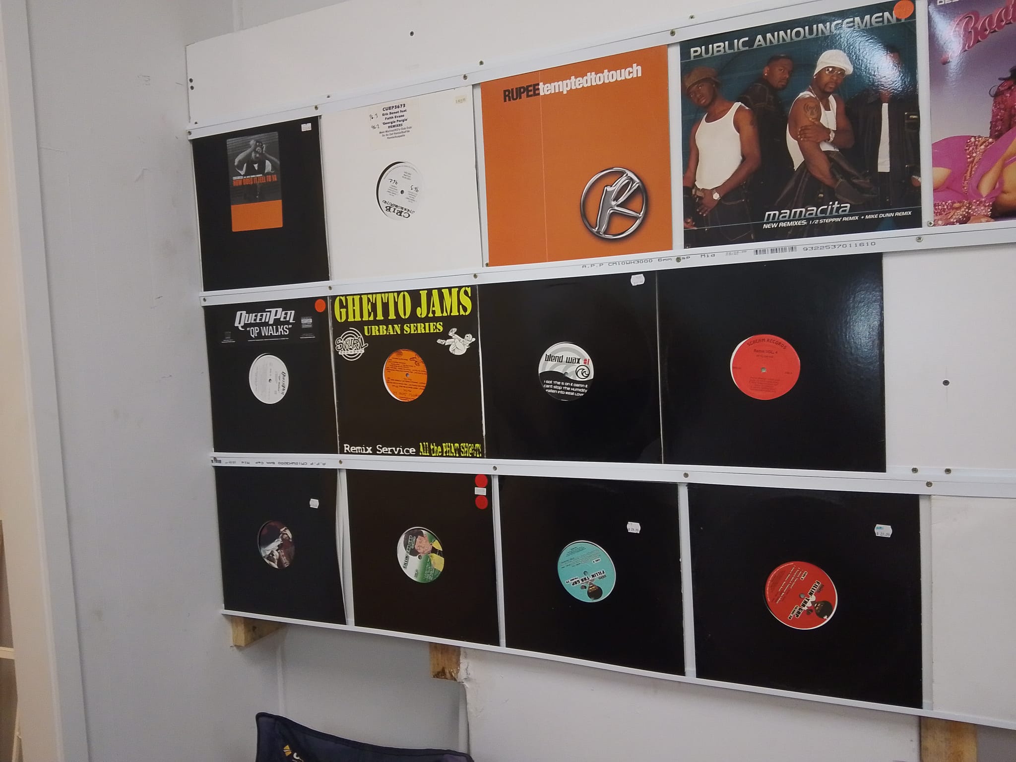 Vinyl records displayed on the wall at RockMasta Records